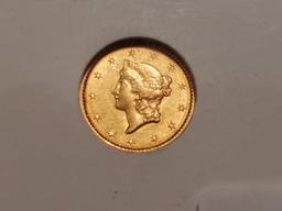 GOLD! NGC 1849 Open Wreath Gold Dollar in About Uncirculated 58