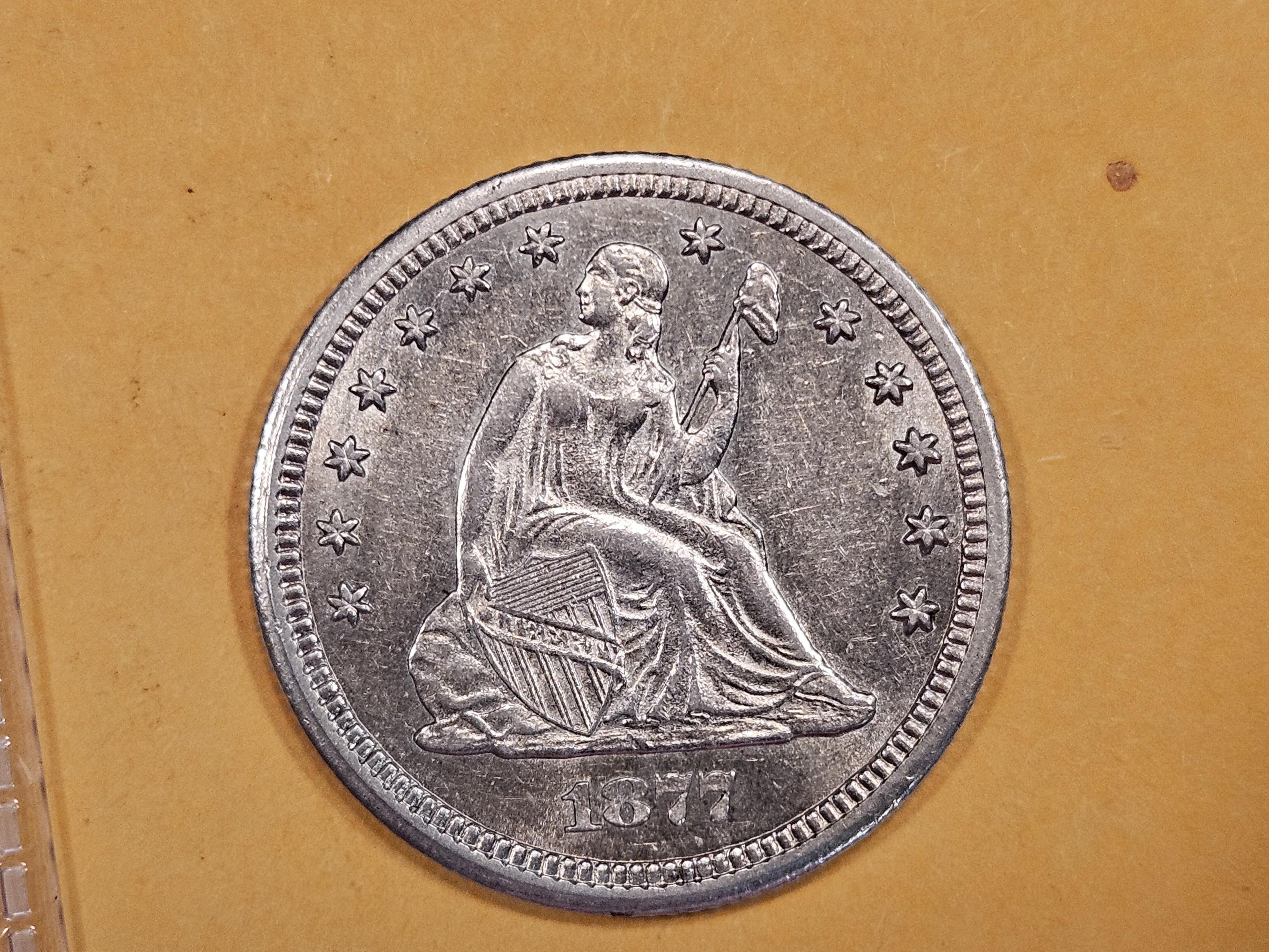 * NICE! 1877-CC Seated Liberty Quarter in Brilliant About Uncirculated - 58