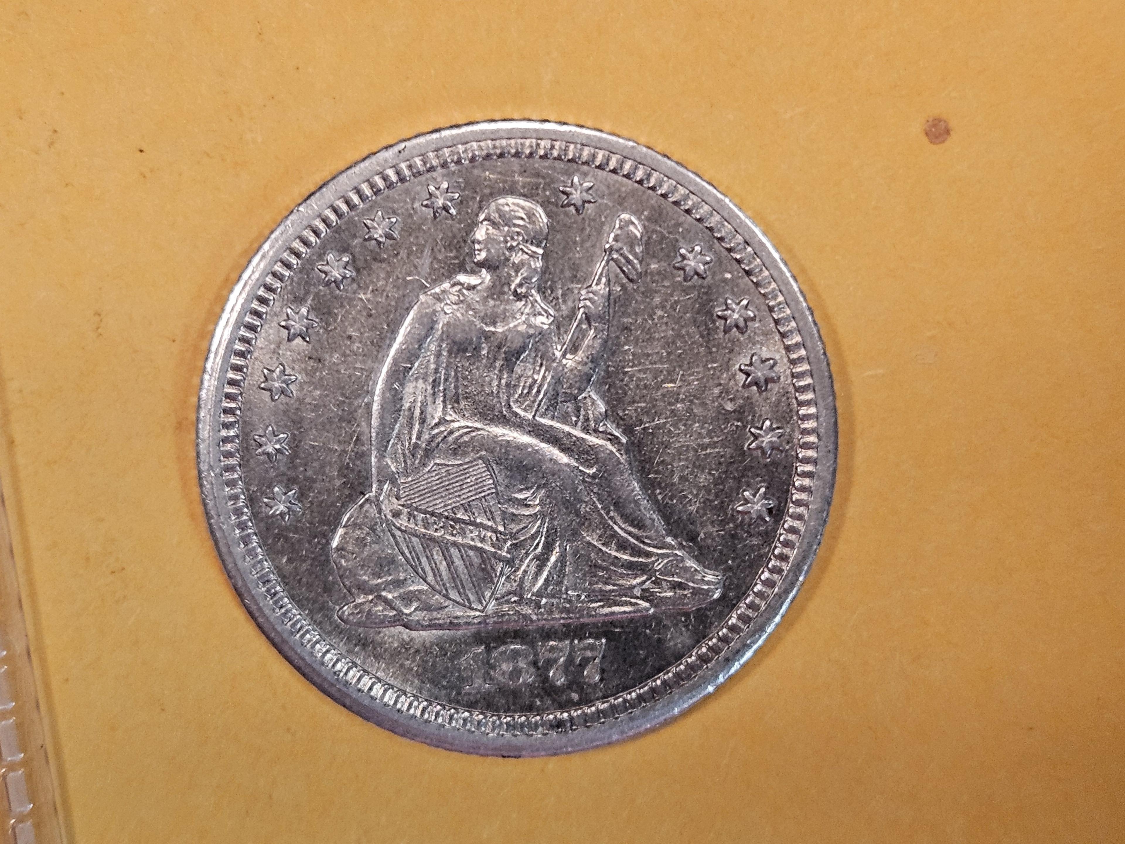 * NICE! 1877-CC Seated Liberty Quarter in Brilliant About Uncirculated - 58