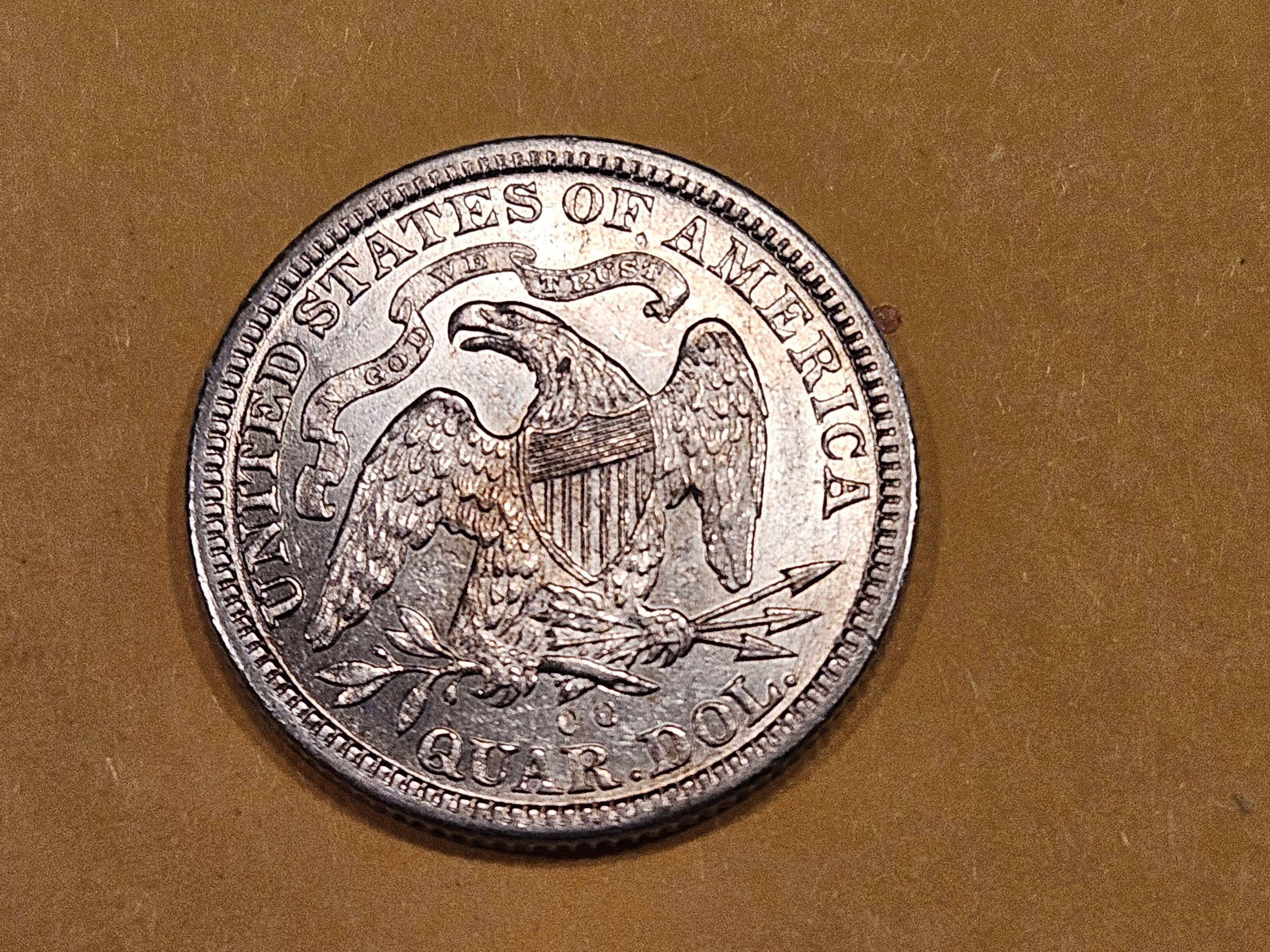 * NICE! 1877-CC Seated Liberty Quarter in Brilliant About Uncirculated - 58