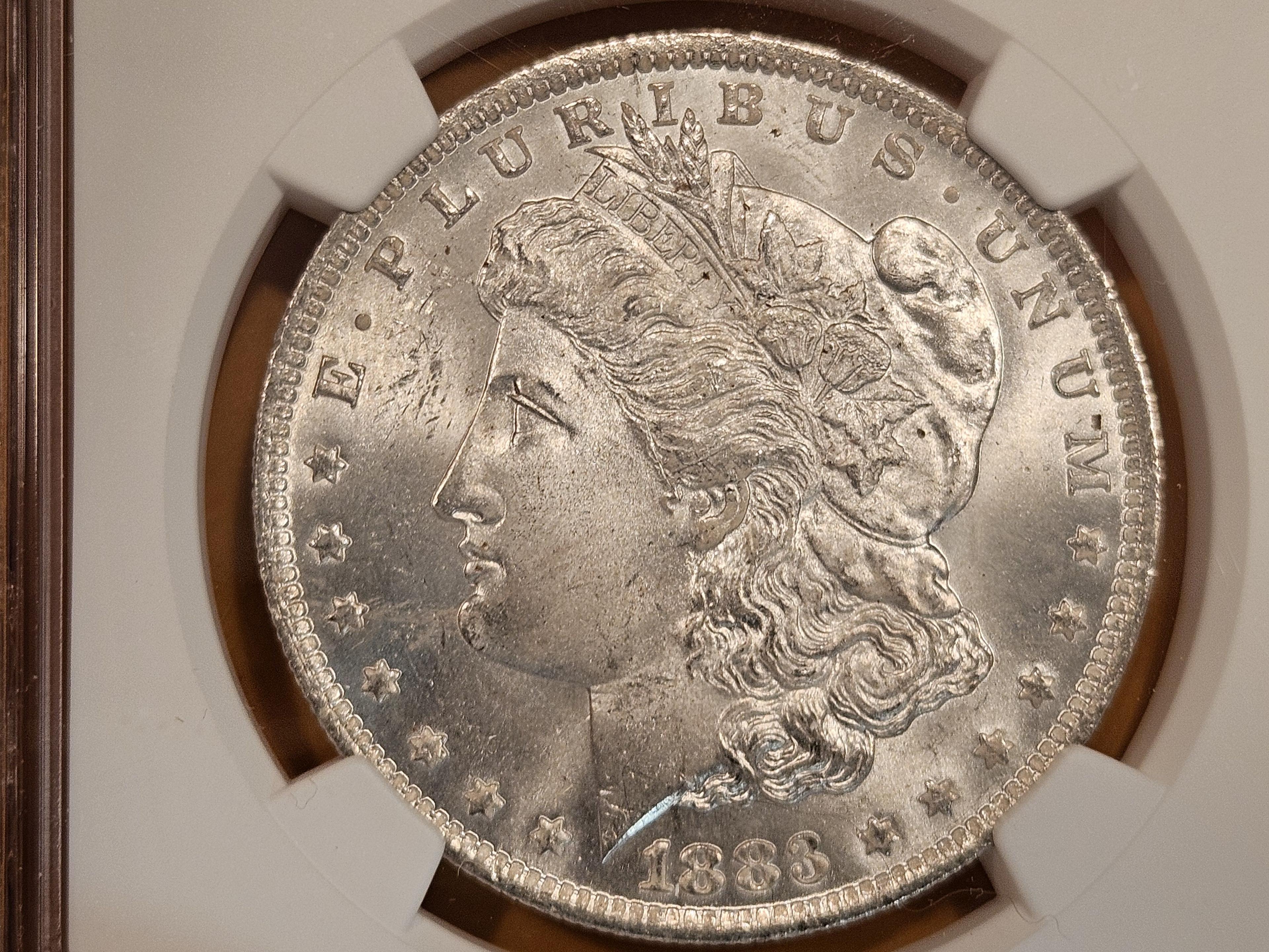 NGC 1883-O Morgan Dollar in Mint State 64