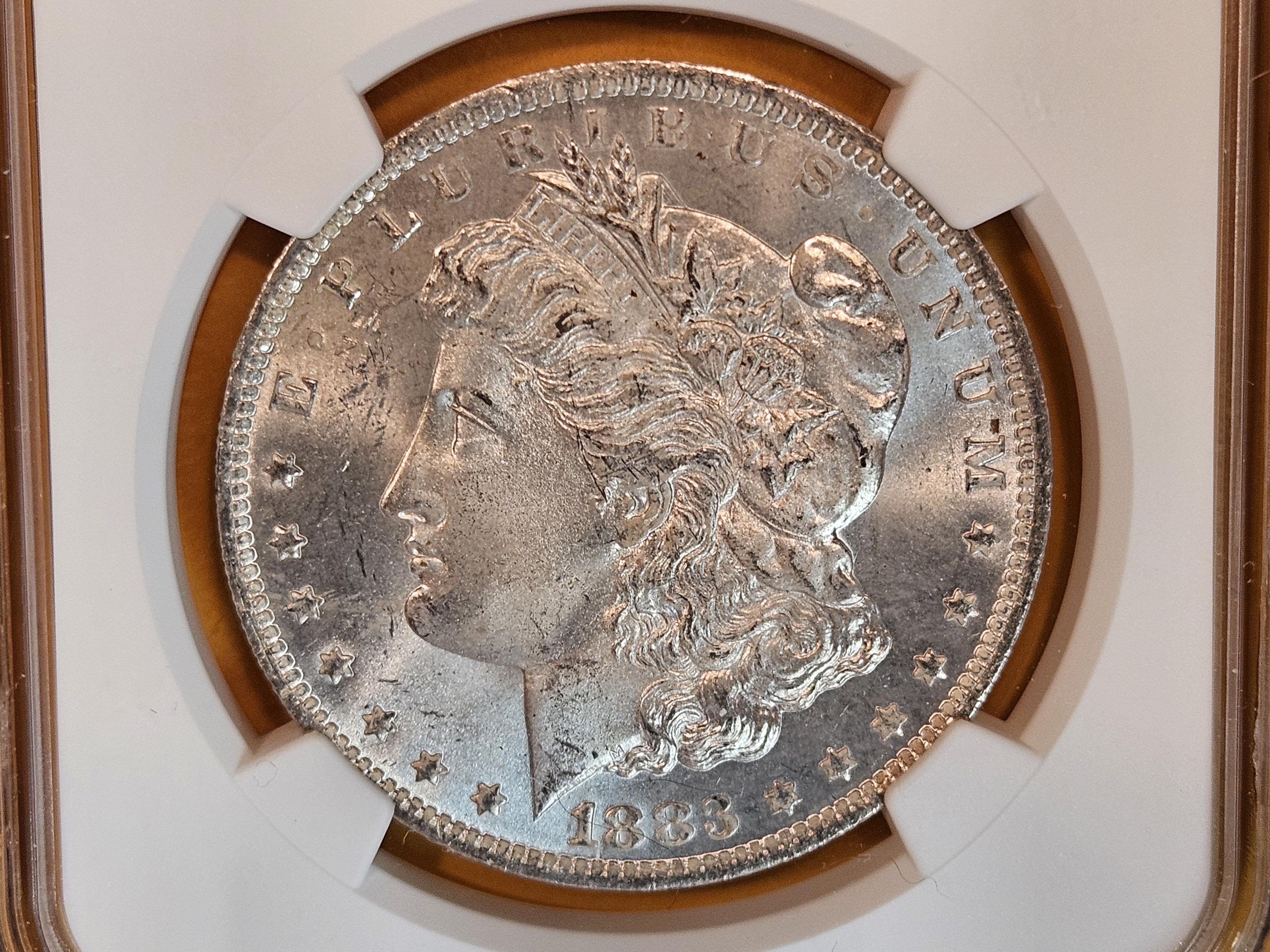 NGC 1883-O Morgan Dollar in Mint State 64