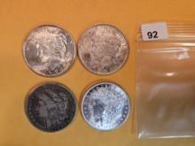 Four mixed Silver Dollars