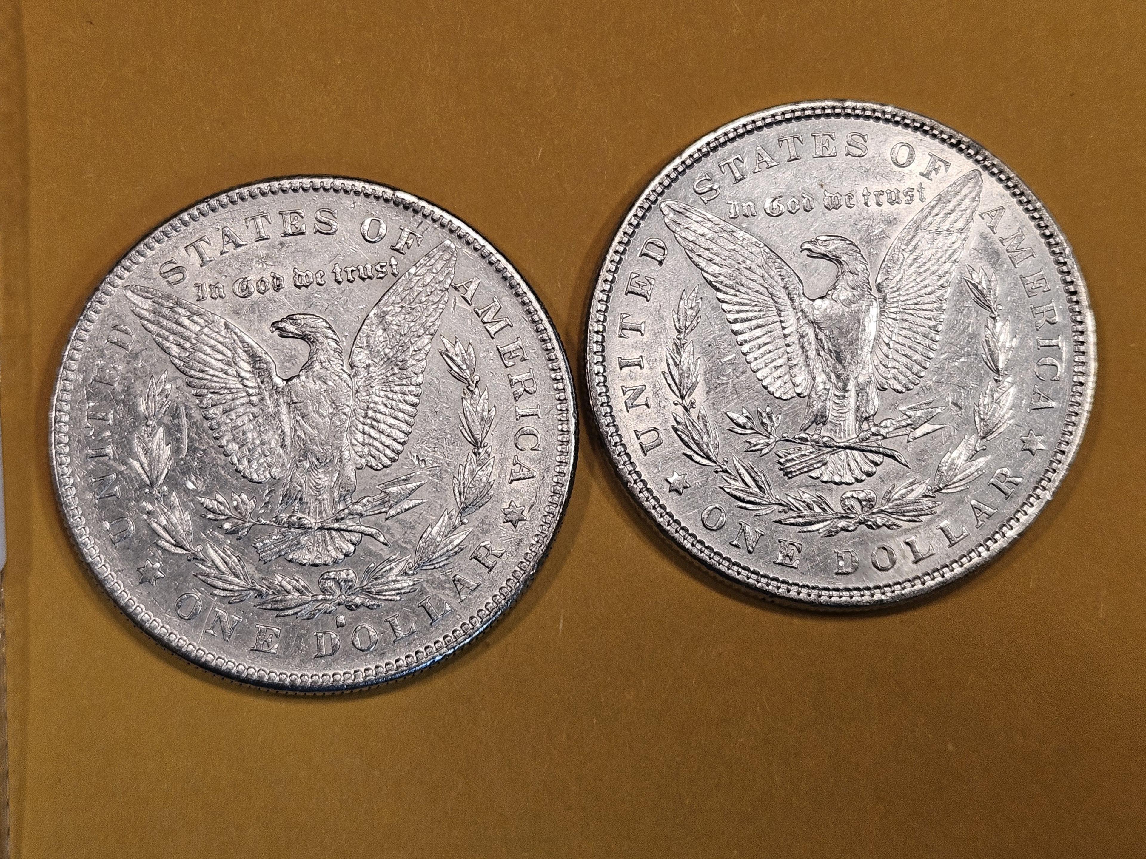 Two About Uncirculated Morgan Dollars