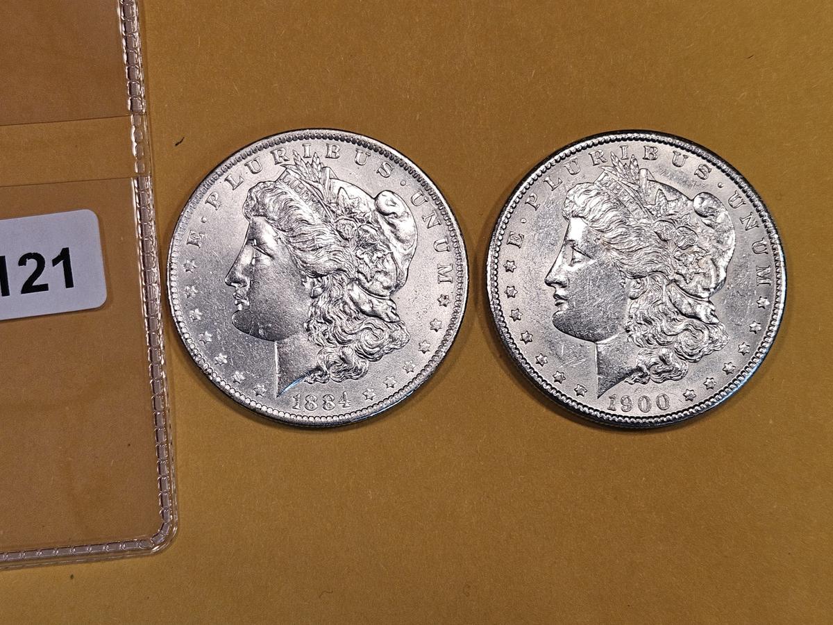 Two About Uncirculated Morgan Dollars