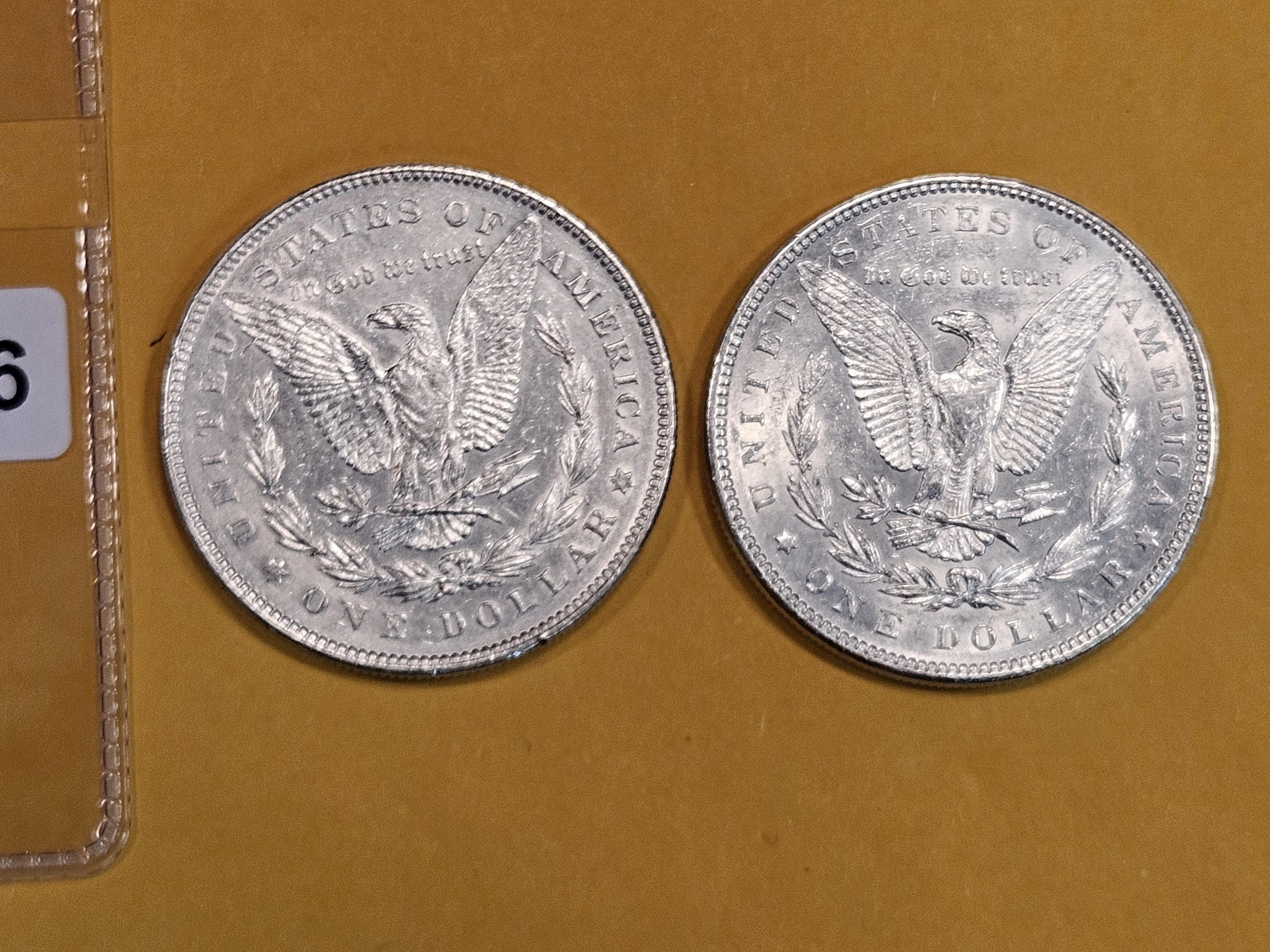 Two About Uncirculated Morgan Dollars