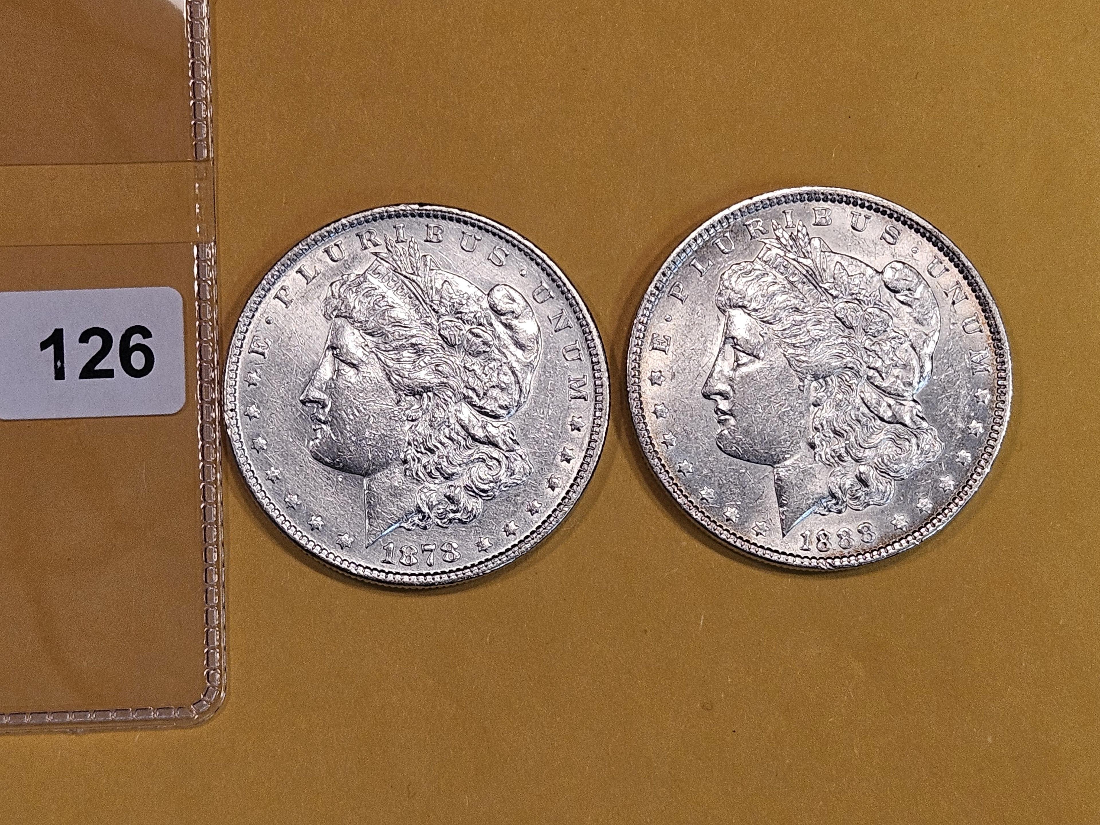 Two About Uncirculated Morgan Dollars