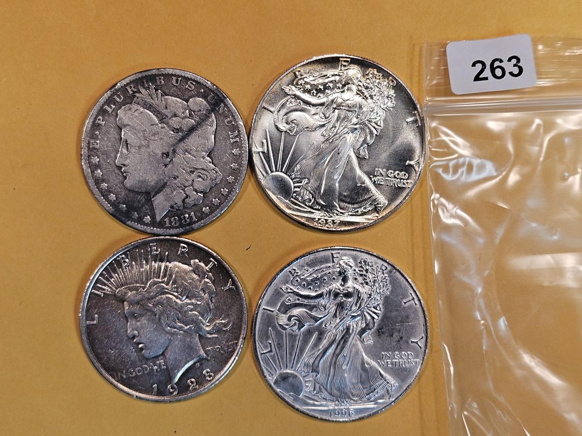 Four mixed Silver Dollars