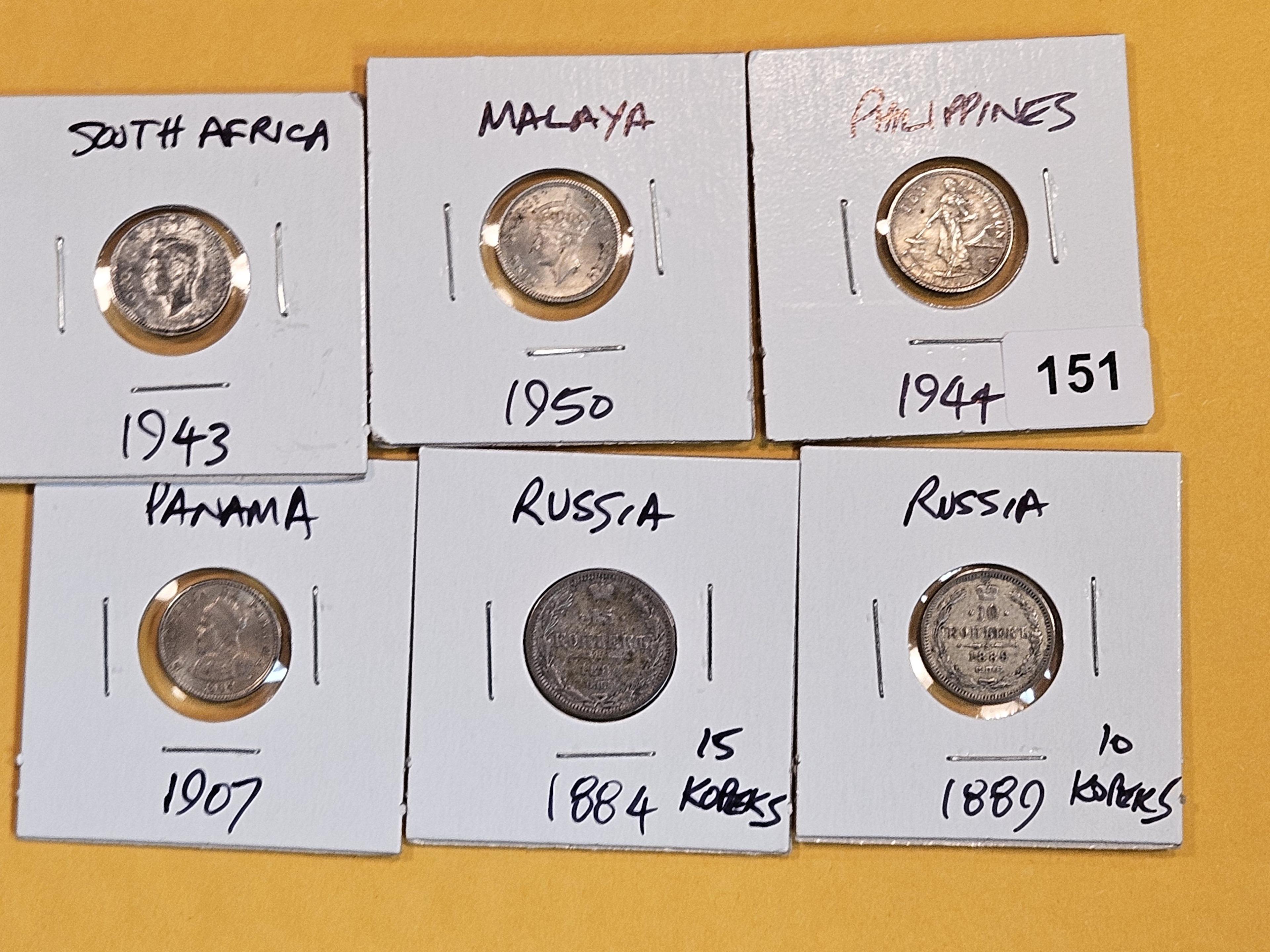 Six Fun small silver World coins