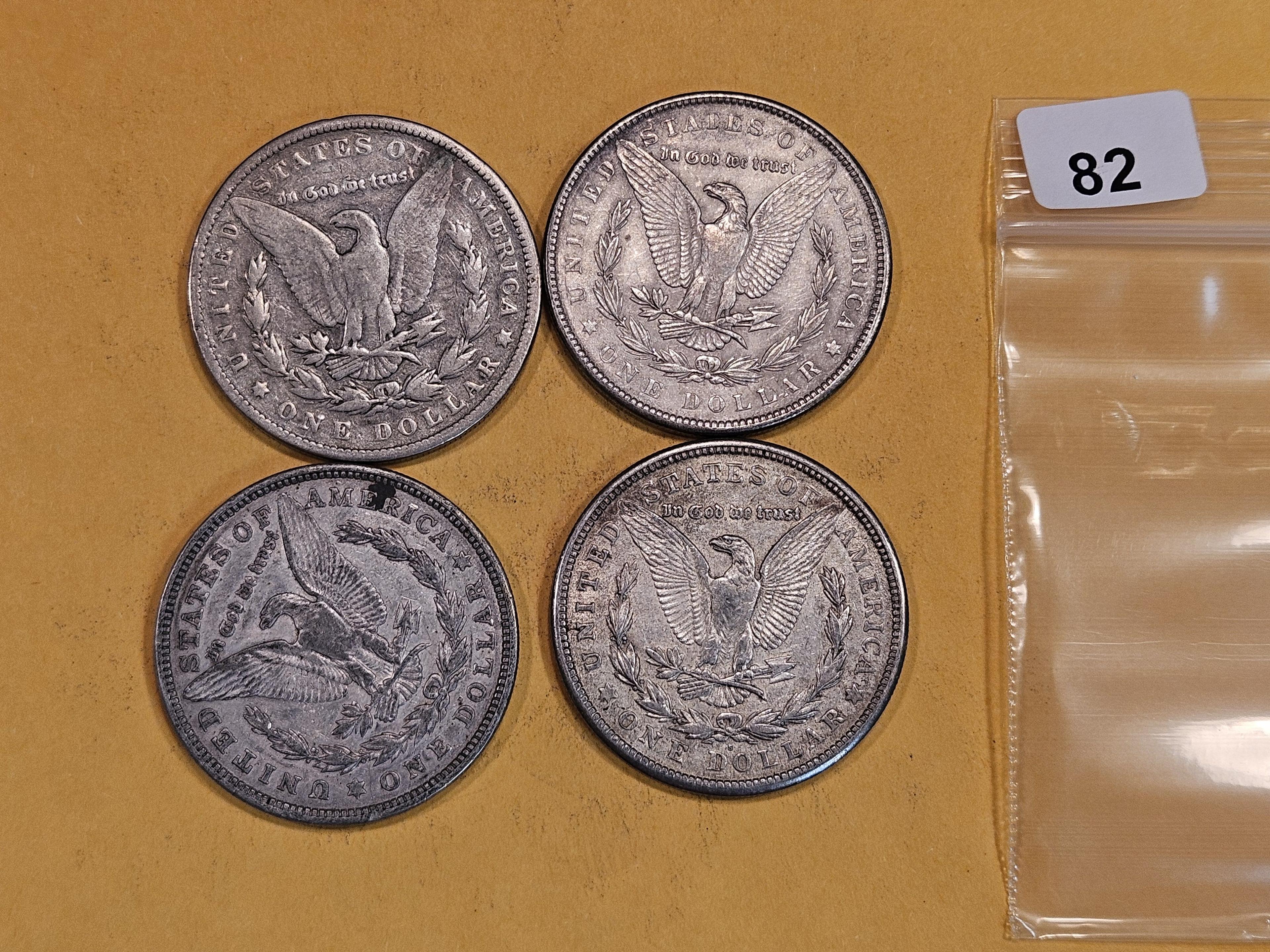 Four mixed Morgan Silver Dollars