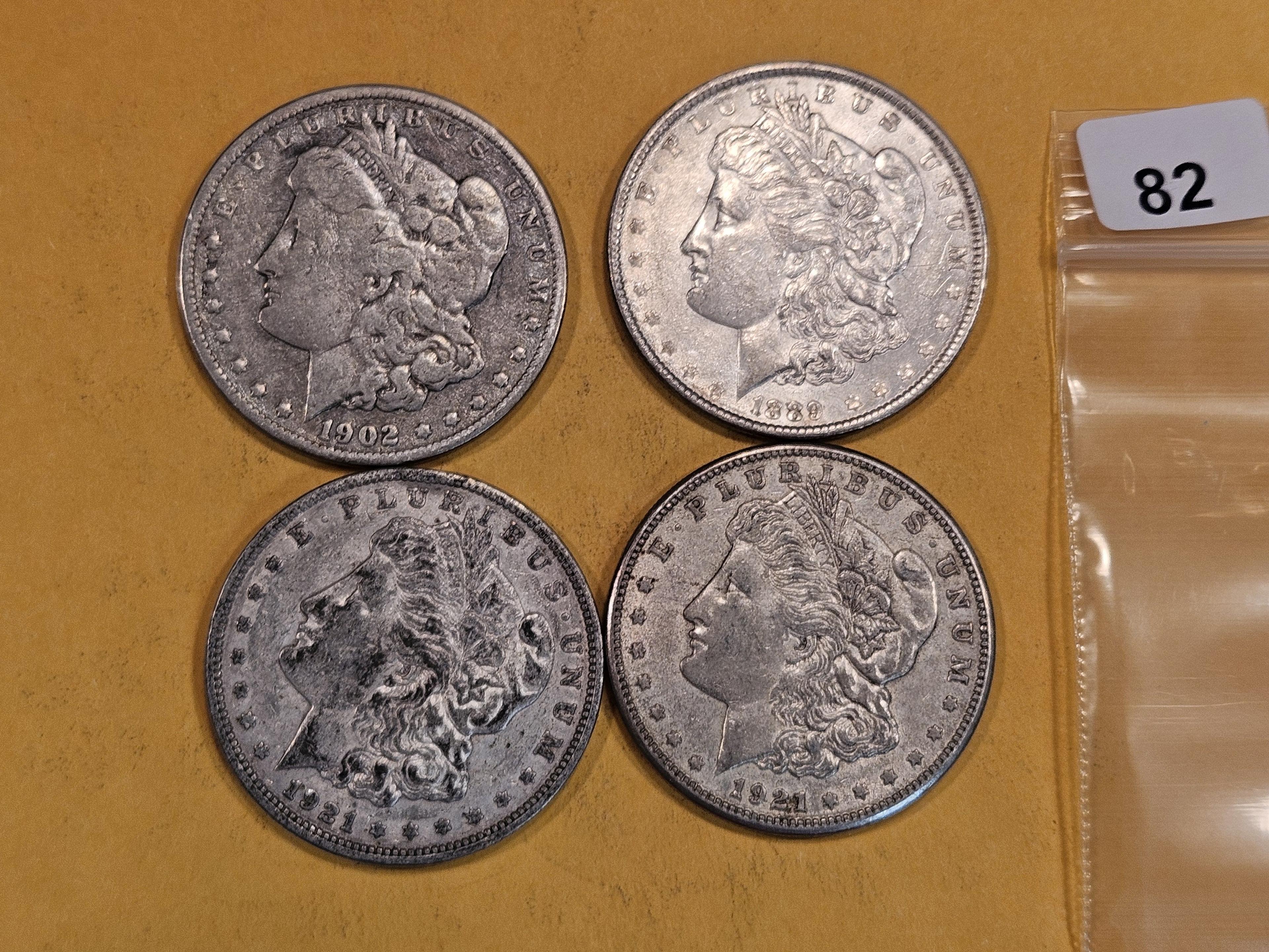 Four mixed Morgan Silver Dollars