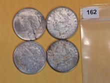 Four mixed Silver Dollars