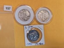 Three mixed silver half dollars