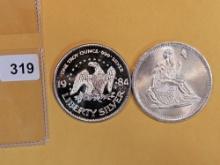 Two 1 Troy Ounce .999 fine silver art rounds