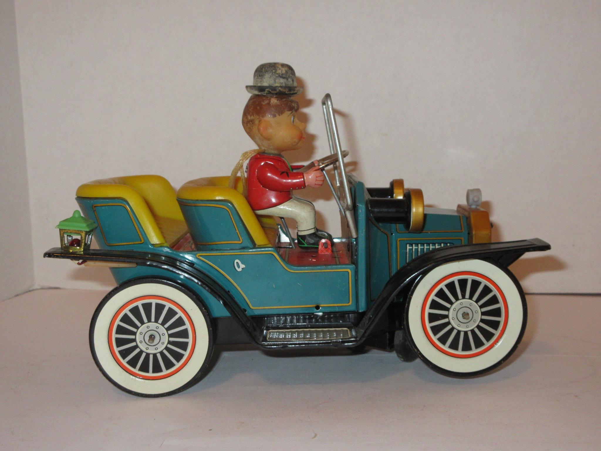 "Old Fashioned Mystery Car" Battery Operated - Beautiful Tin Litho Piece