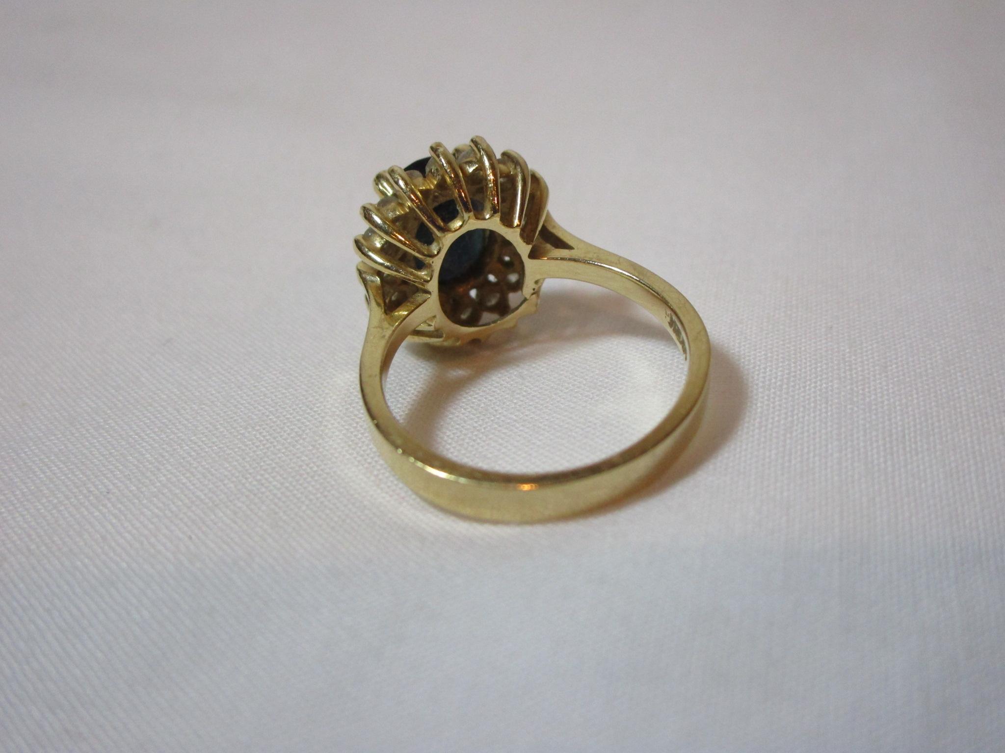 Oval Sapphire Mounted In 14k Yellow, Surrounded by 16 Diamonds - See Picture for Appraisal