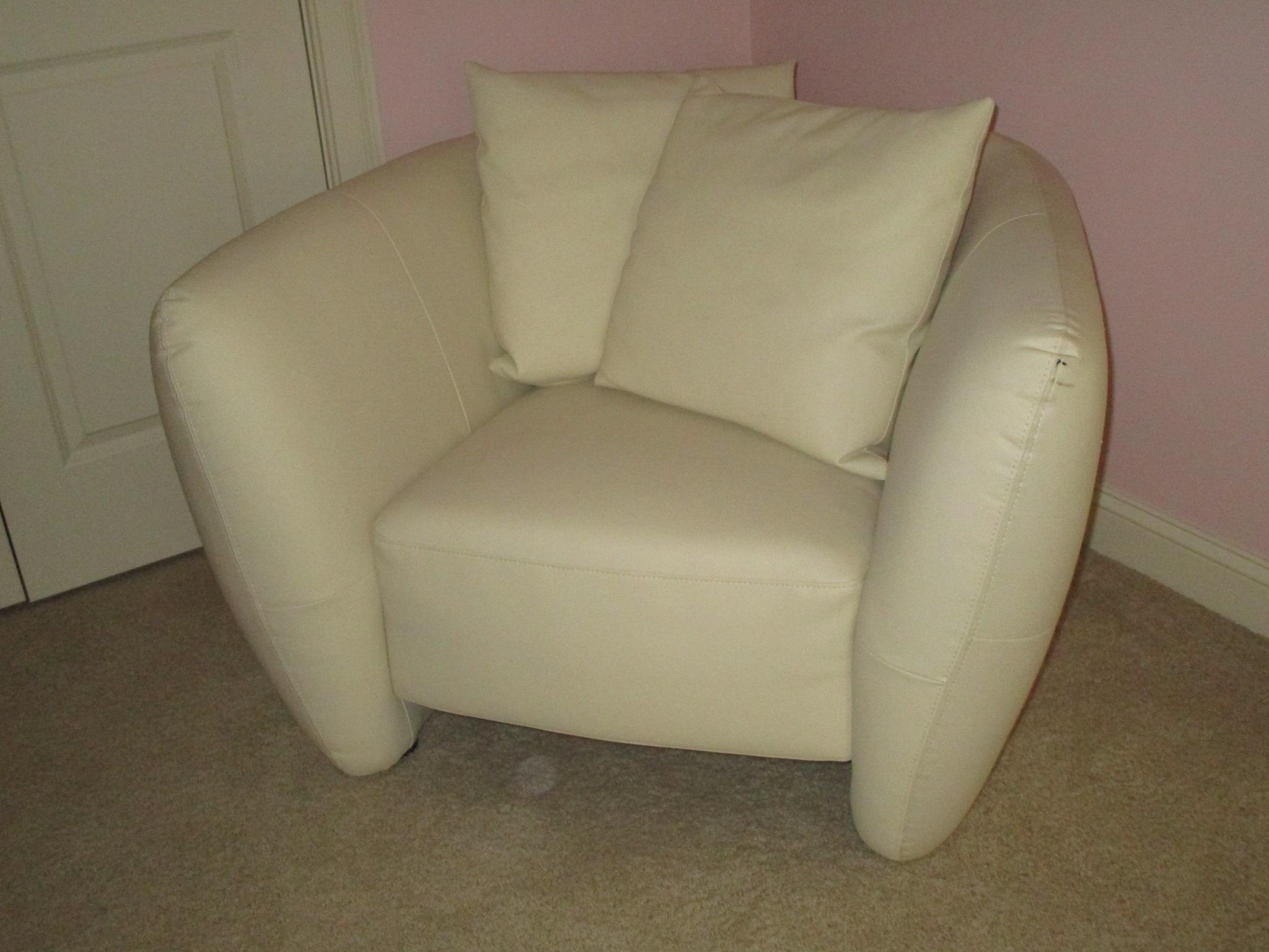 White Leather Chair w/Tufted Sides.  Small ink mark on arm rest, prick marks