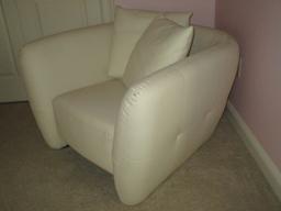 White Leather Chair w/Tufted Sides.  Small ink mark on arm rest, prick marks