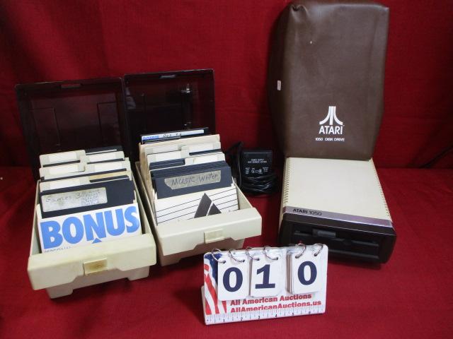 Atari 1050 Disc Drive w/ Two Boxes of Discs and Power Supply