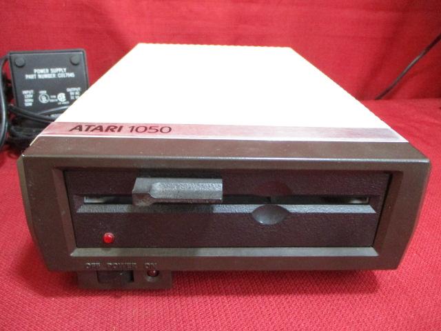 Atari 1050 Disc Drive w/ Two Boxes of Discs and Power Supply