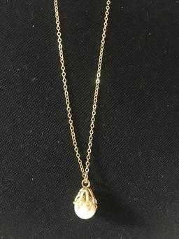 21inch 14 kt, y/g chain with a single pearl.