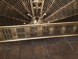 Brass fireplace surround and cherub motif fireplace screen