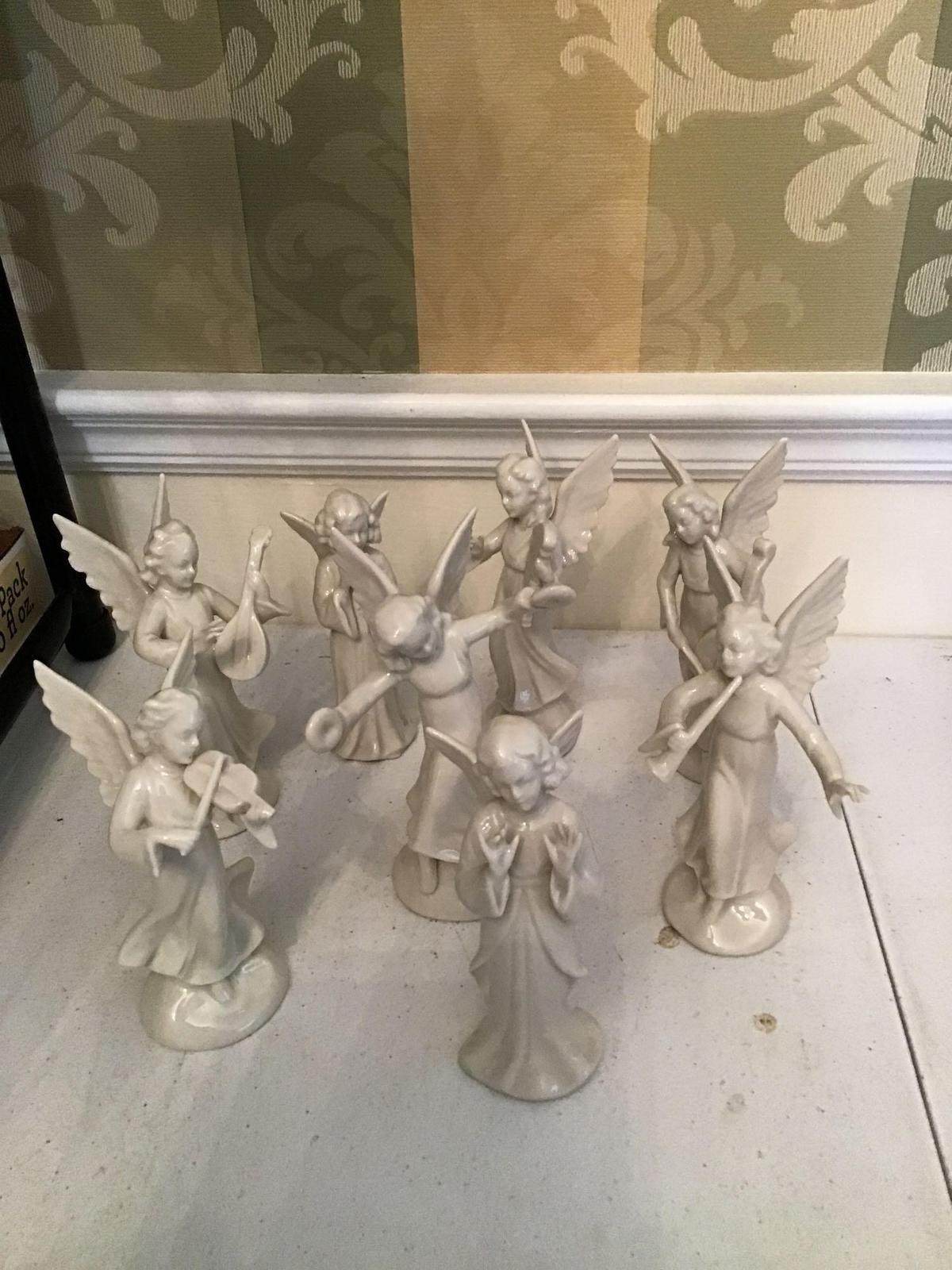 A lot of eight Dresden Germany angel figurines