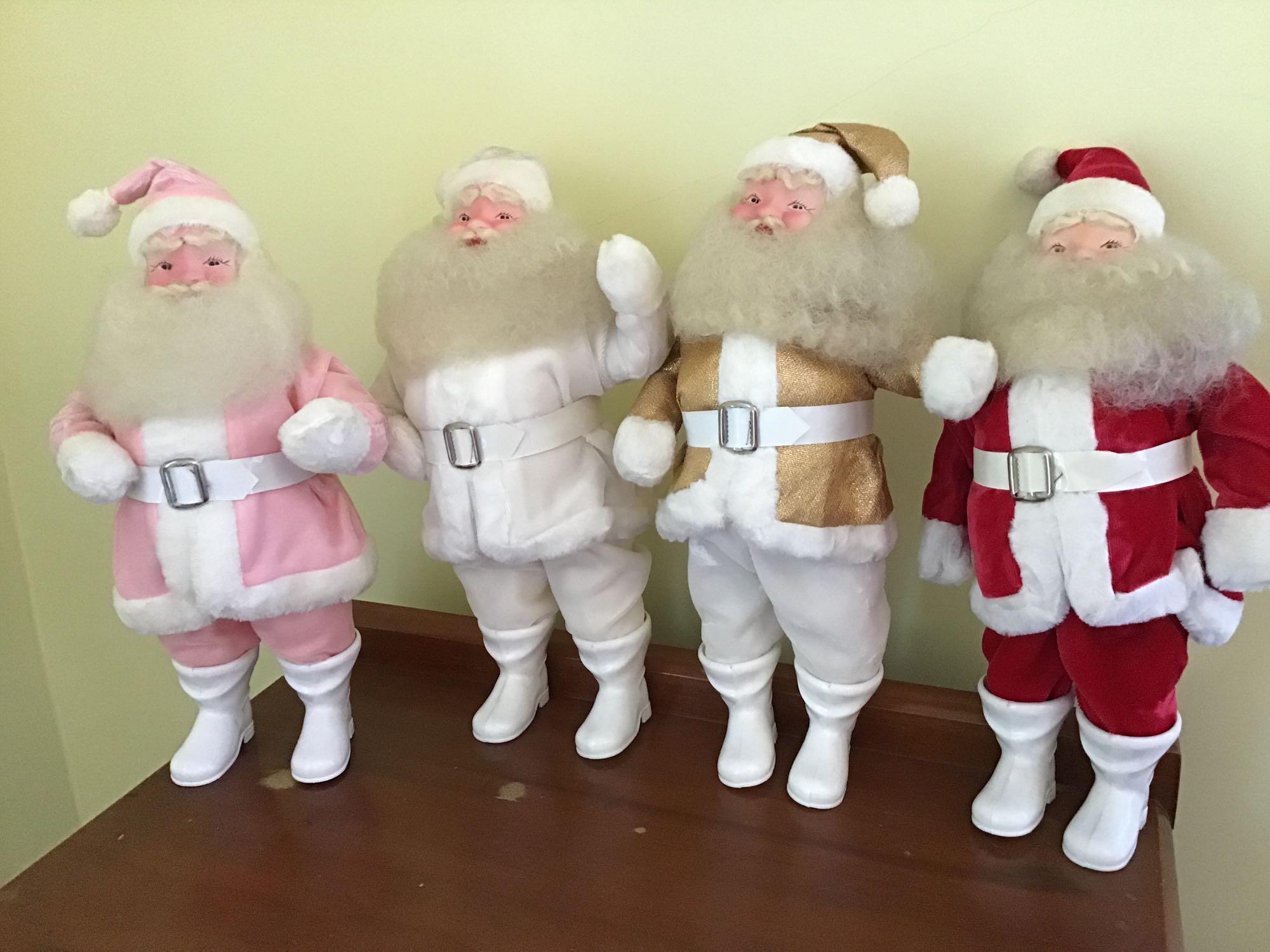 Four vintage Santas 15 inches tall. Plastic faces
