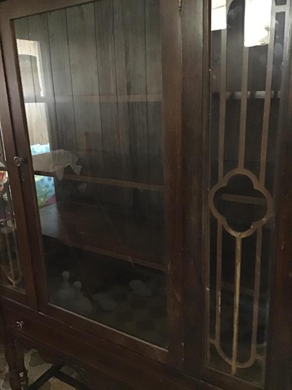 Glass front China cabinet with bottom drawer.