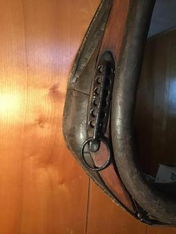 Oak and iron horse collar mirror. Measures 30