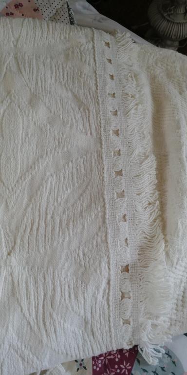 Ecru cotton bedspread.  Full with fringed edges