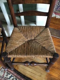 Pair of Ancient English oak ladderback chairs.  Rush seats.  39 tall x 18.5 inches