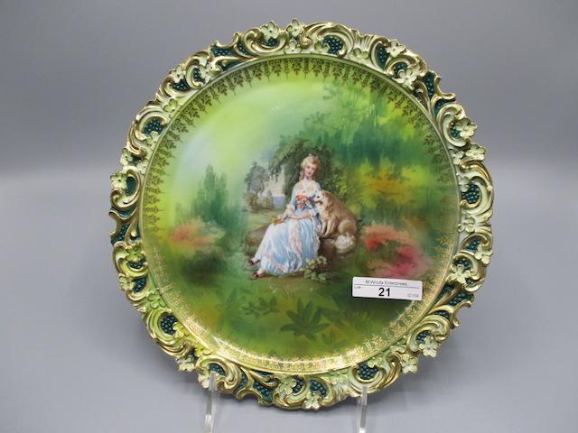 RS Prussia 10" plaque w/ Lady & Dog decor. Border has embossed floral in re