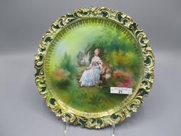 RS Prussia 10" plaque w/ Lady & Dog decor. Border has embossed floral in re