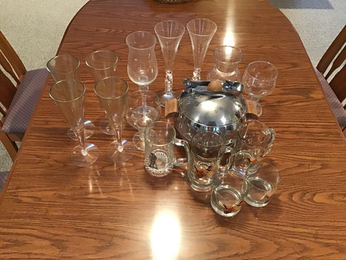 Ice Bucket w/ several glasses and 4 plastic wine glasses