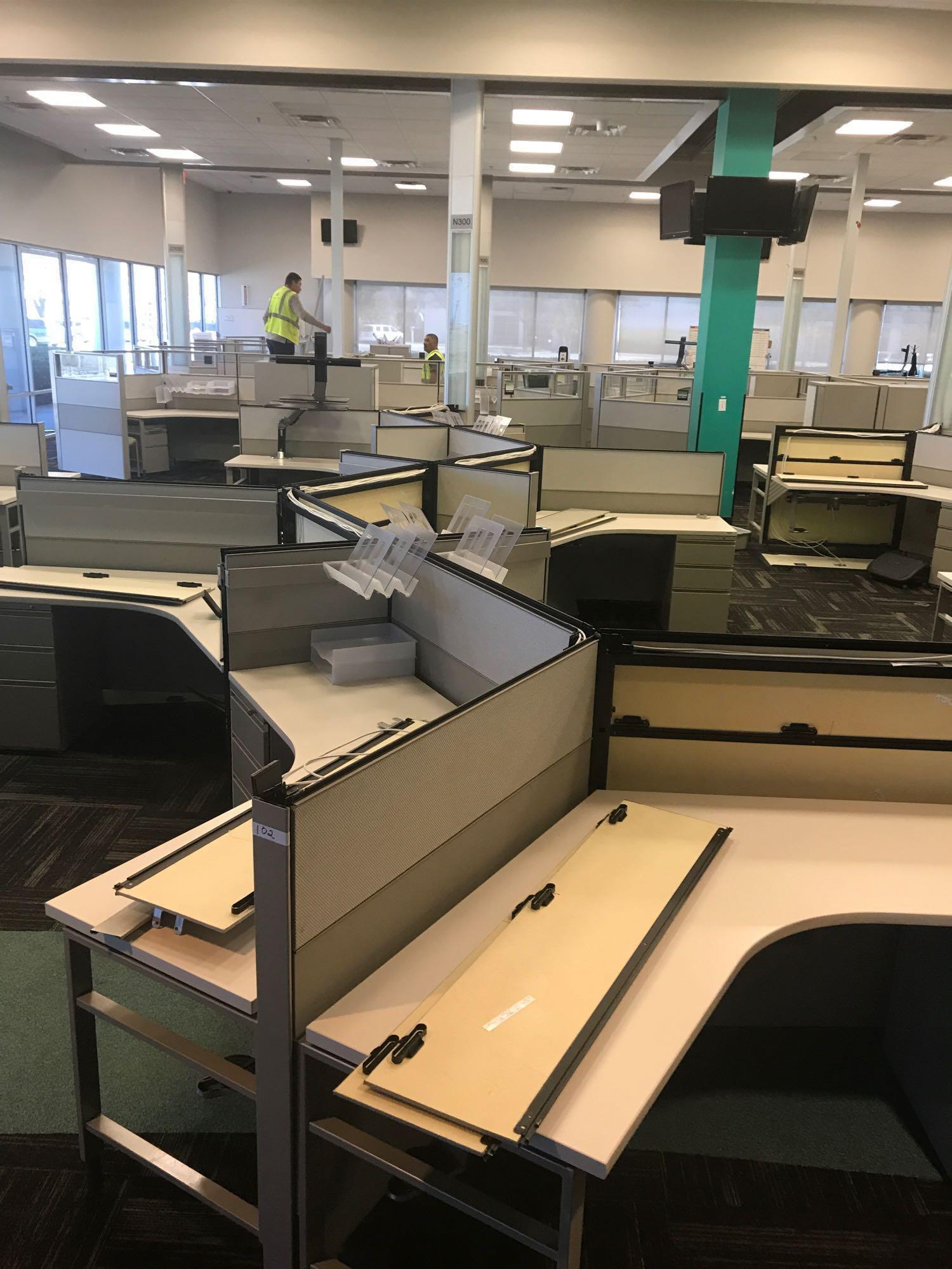 12 desk cubicle system with 1 Ergotron sit-stand integrated platform