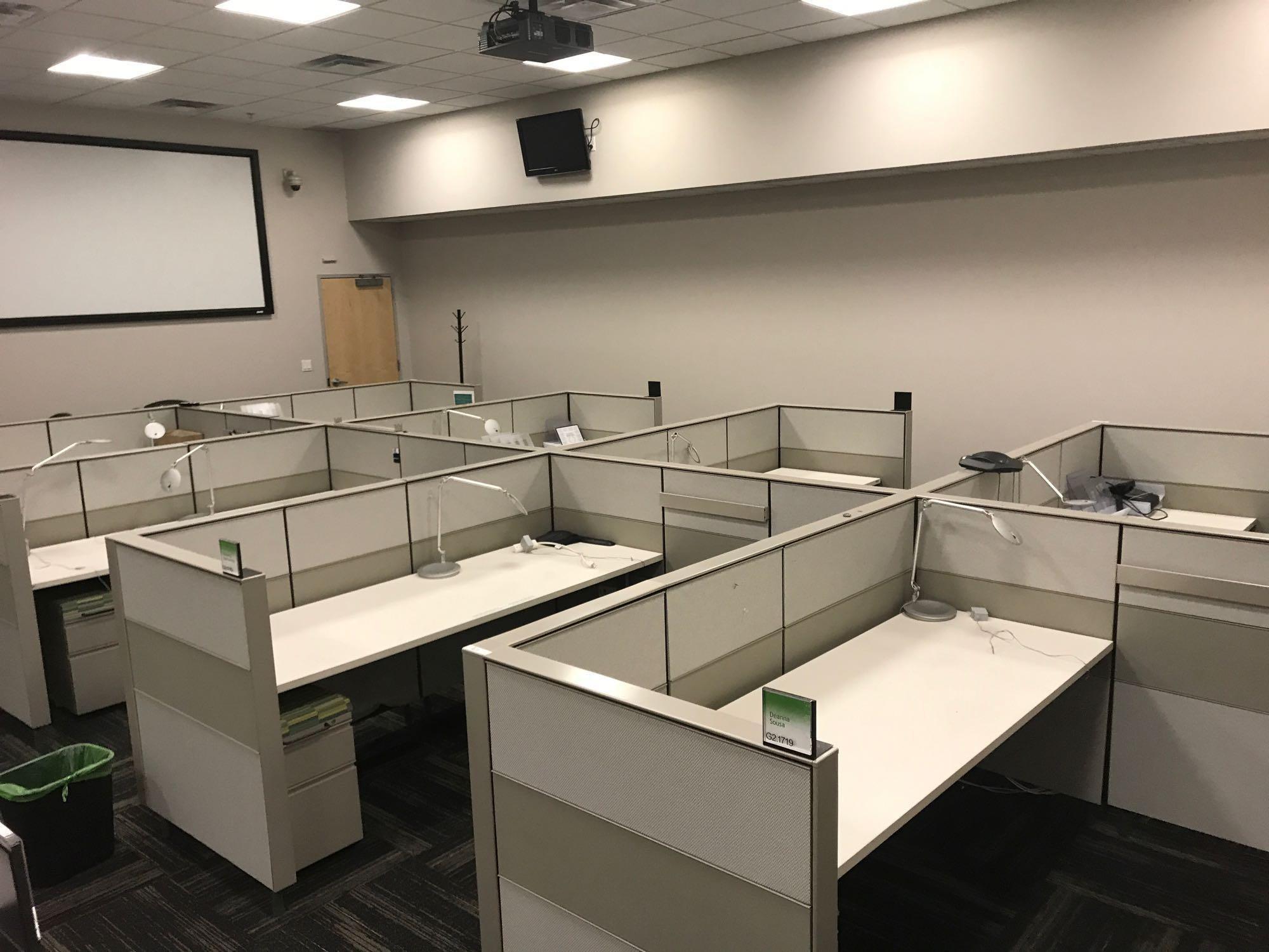 12 desk cubicle system with 1 Ergotron sit-stand integrated platform