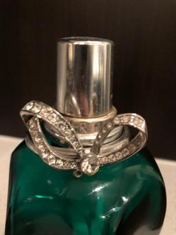 Lampe Berger Glass green fragrance bottle.