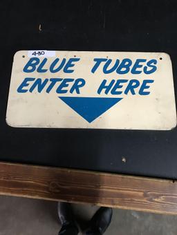 Blue tubes enter here sign