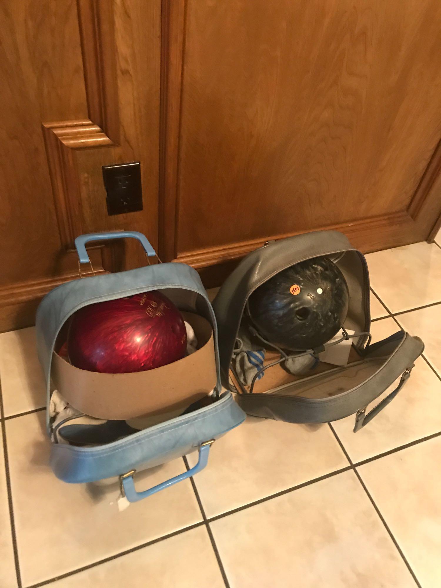 Pair of bowling balls in bags