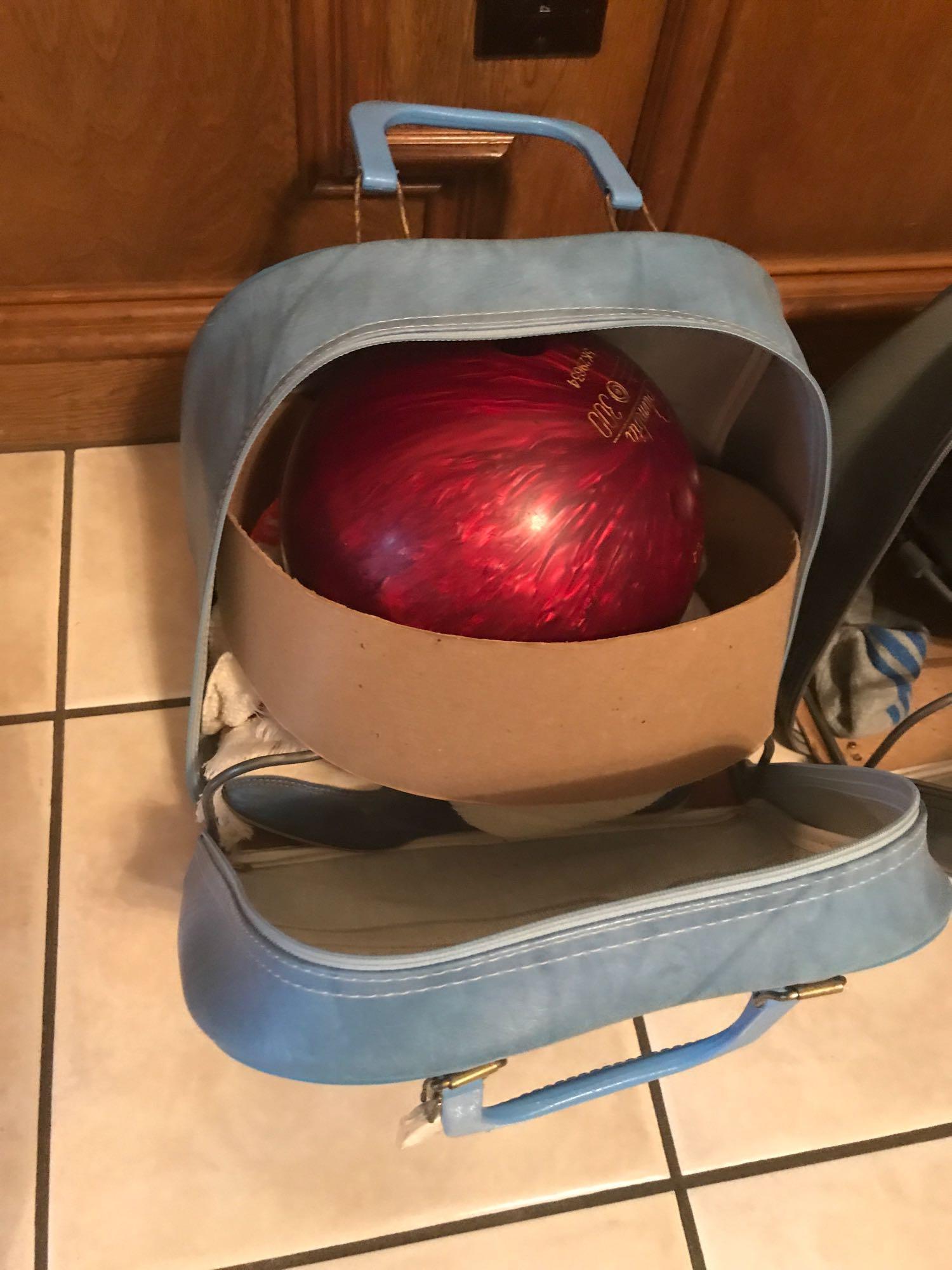 Pair of bowling balls in bags