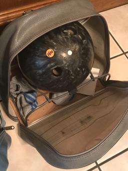 Pair of bowling balls in bags