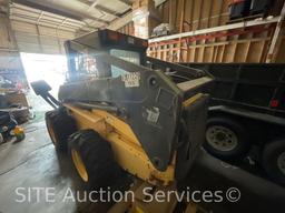 2003 New Holland LS180 Skid Steer w/ Bradco 511 Backhoe Attachment