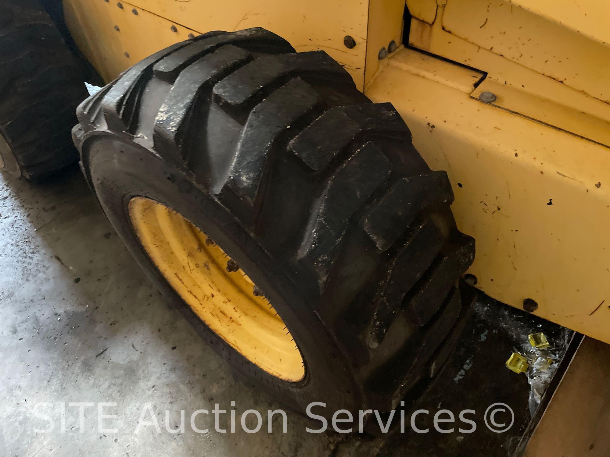 2003 New Holland LS180 Skid Steer w/ Bradco 511 Backhoe Attachment