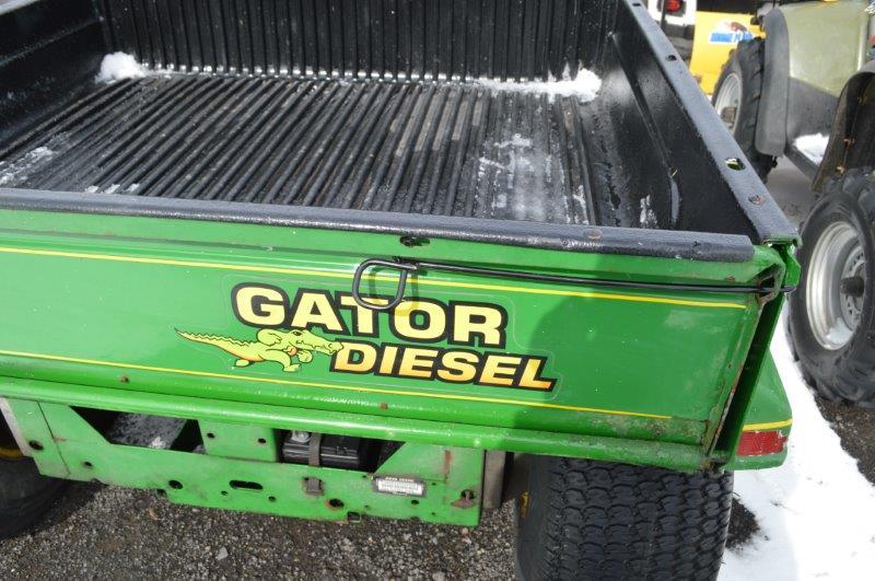 JD 6X4 gator w/ Deisel, manual dumping bed, 1,484 hrs.