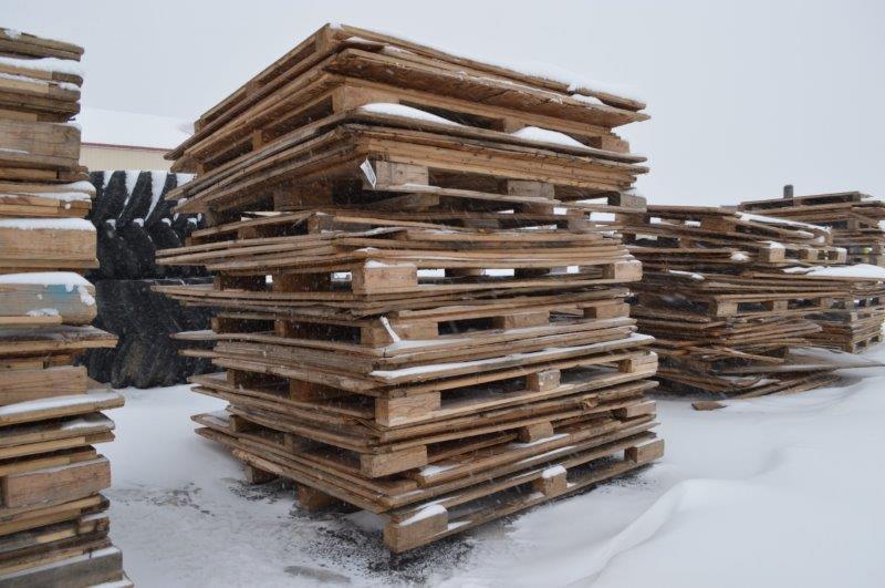 3 stacks of pallets and plywood