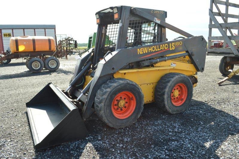 '03 NH LS180 skid loader w/ 4,000 hrs, 2 speed, sells w/ new 72" material bucket