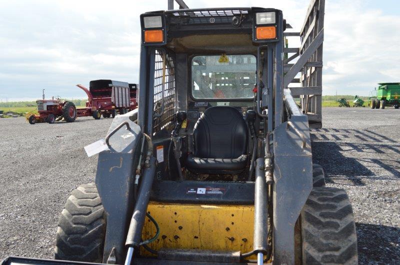 '03 NH LS180 skid loader w/ 4,000 hrs, 2 speed, sells w/ new 72" material bucket