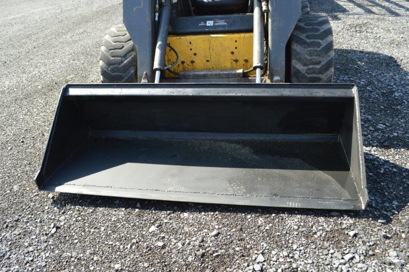 '03 NH LS180 skid loader w/ 4,000 hrs, 2 speed, sells w/ new 72" material bucket