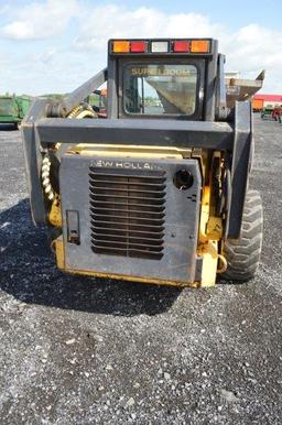 '03 NH LS180 skid loader w/ 4,000 hrs, 2 speed, sells w/ new 72" material bucket